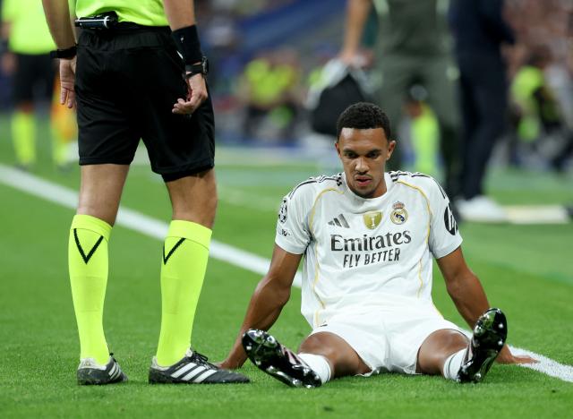 Real Madrid's English defender #12 Trent Alexander-Arnold reacts on the ground after suffering an injury during the UEFA Champions League first round day 1 football match between Real Madrid CF and Olympique de Marseille at the Santiago Bernabeu stadium in Madrid on September 16, 2025. (Photo by Thomas COEX / AFP)