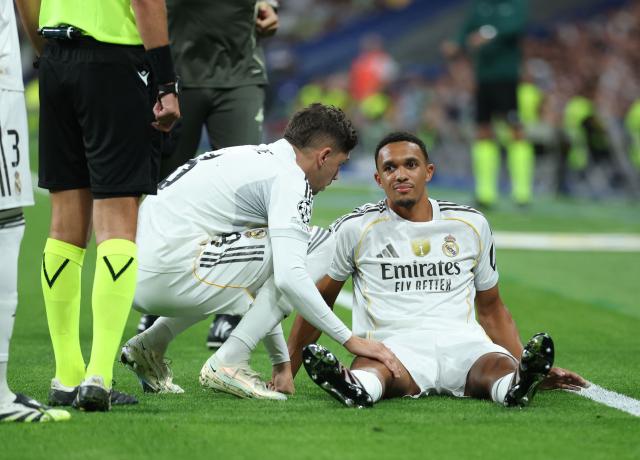 Real Madrid's English defender #12 Trent Alexander-Arnold reacts on the ground after suffering an injury during the UEFA Champions League first round day 1 football match between Real Madrid CF and Olympique de Marseille at the Santiago Bernabeu stadium in Madrid on September 16, 2025. (Photo by Thomas COEX / AFP)