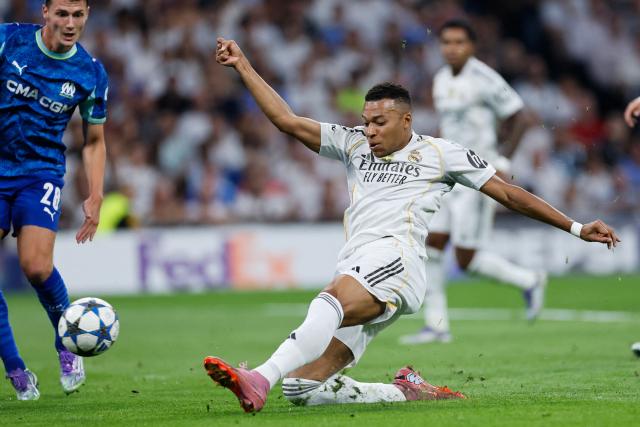 TOPSHOT - Real Madrid's French forward #10 Kylian Mbappe shoots during the UEFA Champions League first round day 1 football match between Real Madrid CF and Olympique de Marseille at the Santiago Bernabeu stadium in Madrid on September 16, 2025. (Photo by Oscar DEL POZO / AFP)