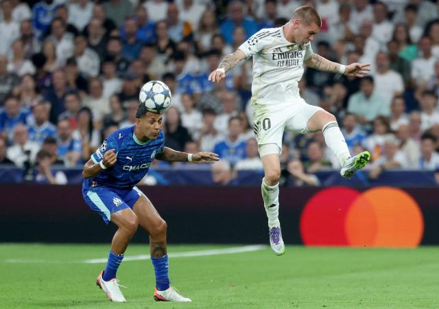 Marseille's Argentine defender #32 Facundo Medina head next to Real Madrid's Argentine forward #30 Franco Mastantuono during the UEFA Champions League first round day 1 football match between Real Madrid CF and Olympique de Marseille at the Santiago Bernabeu stadium in Madrid on September 16, 2025. (Photo by Thomas COEX / AFP)