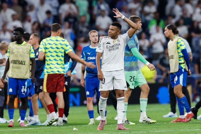 Real Madrid's French forward #10 Kylian Mbappe reacts at the end of the UEFA Champions League first round day 1 football match between Real Madrid CF and Olympique de Marseille at the Santiago Bernabeu stadium in Madrid on September 16, 2025. Real Madrid won 2-1. (Photo by Oscar DEL POZO / AFP)