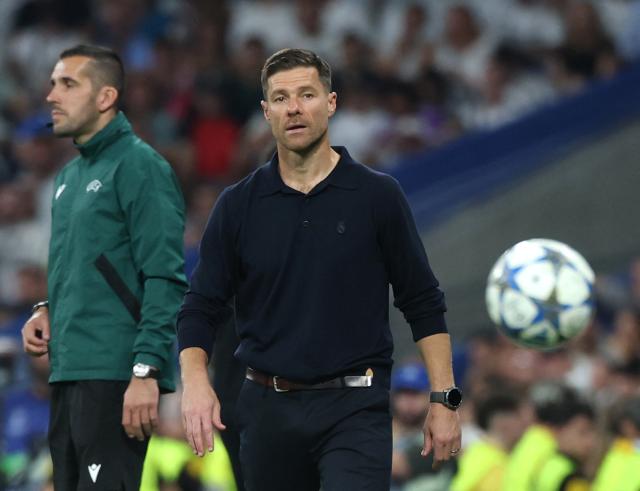 Real Madrid's Spanish coach Xabi Alonso looks on at the end of the UEFA Champions League first round day 1 football match between Real Madrid CF and Olympique de Marseille at the Santiago Bernabeu stadium in Madrid on September 16, 2025. (Photo by Thomas COEX / AFP)
