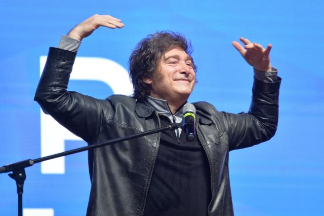 Argentina's President Javier Milei gestures during a meeting with young people from the Industrial Entrepreneurs Forum of Paraguay (FEIP) at the headquarters of the National Sports Secretariat (SND) in Asuncion on September 16, 2025. (Photo by Daniel DUARTE / AFP)