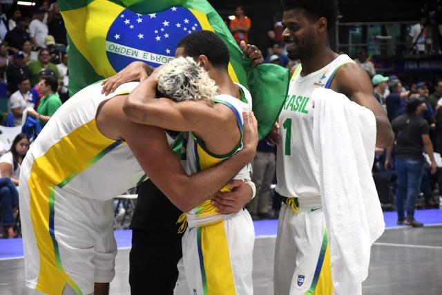 Brazil's players celebrate after winning the FIBA Men's Americup 2025 semifinal basketball match between US and Brazil at the Polideportivo Alexis Arguello Stadium in Managua on August 30, 2025. (Photo by AFP)