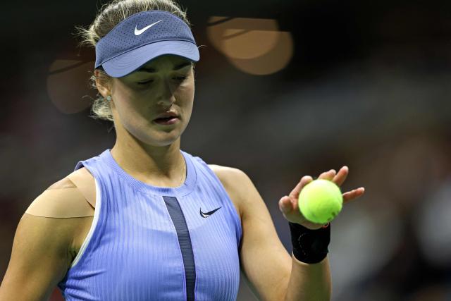 Russia's Anna Kalinskaya prepares to serve to Poland's Iga Swiatek during their women's singles third round match against on day seven of the US Open tennis tournament at the USTA Billie Jean King National Tennis Center in New York City, on August 30, 2025. (Photo by CHARLY TRIBALLEAU / AFP)