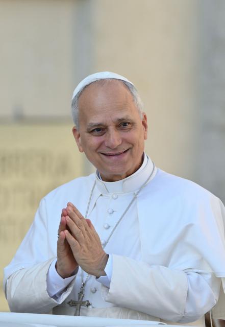 Pope Leo XIV waves to the crowd as he arrives during his weekly general audience at St. Peter’s square in the Vatican, on September 17, 2025. (Photo by Alberto PIZZOLI / AFP)
