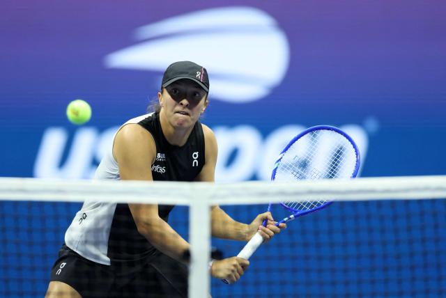 Poland's Iga Swiatek plays a backhand return to Russia's Anna Kalinskaya during their women's singles third round match against on day seven of the US Open tennis tournament at the USTA Billie Jean King National Tennis Center in New York City, on August 30, 2025. (Photo by CHARLY TRIBALLEAU / AFP)