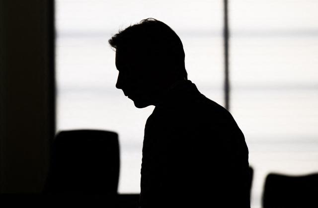 (FILES) Christian B, the man suspected by German authorities of murdering missing British girl Madeleine McCann ("Maddie"), is silhouetted as he arrives at court for a session in his trial of an unrelated case, on May 15, 2024. Christian B is accused of three counts of rape and two counts of child sex abuse allegedly committed in Portugal between 2000 and 2017. The charges are unrelated to the Madeleine McCann case, in which Christian B was sensationally revealed as a suspect in 2020. The man is already behind bars in Germany for raping a 72-year-old American tourist in 2005 in Praia da Luz, the same Portuguese seaside resort where Madeleine McCann, often referred to as Maddie, went missing two years later. (Photo by Julian Stratenschulte / POOL / AFP)