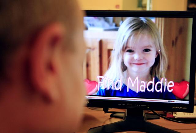 (FILES) A picture of four-year-old British girl Madeleine McCann, who disappeared on a family holiday in Portugal, appears on a computer screen on the YouTube Internet site, 10 August 2007 in Paris. One the eve of the 100th day of their daughter Madeleine's disappearance, Gerry and Kate McCann launched today a new section on YouTube, called "Don't Forget About Me", which features videos of the youngsters with the aim of raising public awareness about their disappearance. Christian B is accused of three counts of rape and two counts of child sex abuse allegedly committed in Portugal between 2000 and 2017. The charges are unrelated to the Madeleine McCann case, in which Christian B was sensationally revealed as a suspect in 2020. The man is already behind bars in Germany for raping a 72-year-old American tourist in 2005 in Praia da Luz, the same Portuguese seaside resort where Madeleine McCann, often referred to as Maddie, went missing two years later. (Photo by Nathalie MAGNIEZ / AFP)