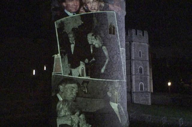 This frame grab made on September 17, 2025 from an AFP video footage dated from September 16, 2025 shows photographs projected onto a tower of the Windsor Castle bearing notorious sex offender Jeffrey Epstein and US President Donald Trump, during an action by activists from the British group Led by Donkeys on the sidelines of Trump's state visit to Britain. Activists from the British group Led by Donkeys holds politicians to account through often humorous campaigns. (Photo by Lena VOELK / AFP)