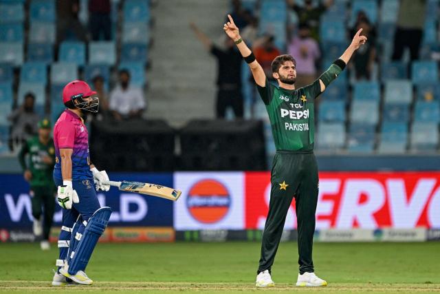 Pakistan's Shaheen Shah Afridi (R) celebrates after taking the wicket of UAE's Alishan Sharafu during the Asia Cup 2025 Twenty20 international cricket match between United Arab Emirates and Pakistan at the Dubai International Stadium in Dubai on September 17, 2025. (Photo by Sajjad HUSSAIN / AFP)