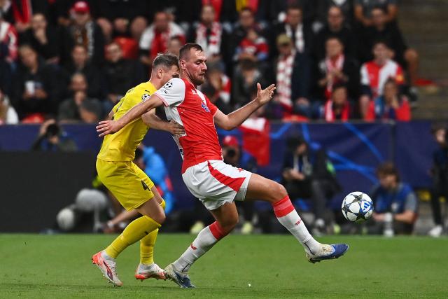 Bodoe/Glimt's Norwegian  #04 Odin Bjortuft and Slavia Prague's Czech forward #25 Tomas Chory vie for the ball during the UEFA Champions League football match between SK Slavia Prague and FK Bodoe/Glimt in Prague on September 17, 2025. (Photo by Michal Cizek / AFP)