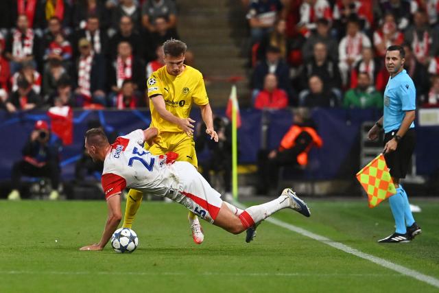 Bodoe/Glimt's Norwegian  #04 Odin Bjortuft and Slavia Prague's Czech forward #25 Tomas Chory vie for the ball during the UEFA Champions League football match between SK Slavia Prague and FK Bodoe/Glimt in Prague on September 17, 2025. (Photo by Michal Cizek / AFP)