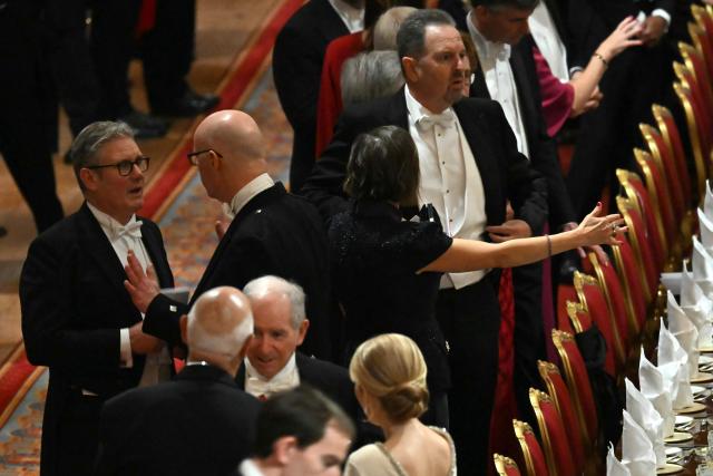 Britain's Prime Minister Keir Starmer (L) attends a State Banquet at Windsor Castle, in Windsor, on September 17, 2025, during the US President's second State Visit. US President Donald Trump arrived in Britain for an unprecedented second State Visit, with the UK government rolling out a royal red carpet welcome to win over the mercurial leader. (Photo by ANDREW CABALLERO-REYNOLDS / POOL / AFP)