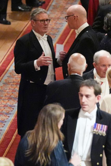 Britain's Prime Minister Keir Starmer (L) attends a State Banquet at Windsor Castle, in Windsor, on September 17, 2025, during the US President's second State Visit. US President Donald Trump arrived in Britain for an unprecedented second State Visit, with the UK government rolling out a royal red carpet welcome to win over the mercurial leader. (Photo by Evan Vucci / POOL / AFP)
