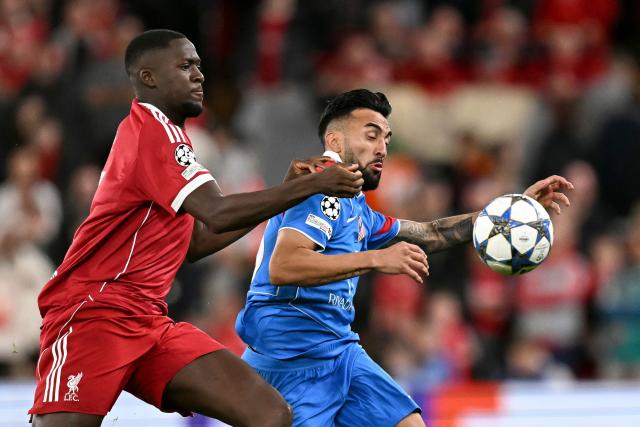 Liverpool's French defender #05 Ibrahima Konate (L) and Atletico Madrid's Argentine midfielder #23 Nico Gonzalez fight for the ball during the UEFA Champions League first round football match between Liverpool and Atletico Madrid at Anfield in Liverpool, north west England on September 17, 2025. (Photo by Oli SCARFF / AFP)
