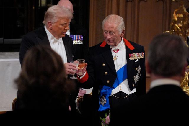 US President Donald Trump and Britain's King Charles III raise their glasses during a State Banquet at Windsor Castle, in Windsor, on September 17, 2025, during the US President's second State Visit. US President Donald Trump arrived in Britain for an unprecedented second State Visit, with the UK government rolling out a royal red carpet welcome to win over the mercurial leader. (Photo by Yui Mok / POOL / AFP)