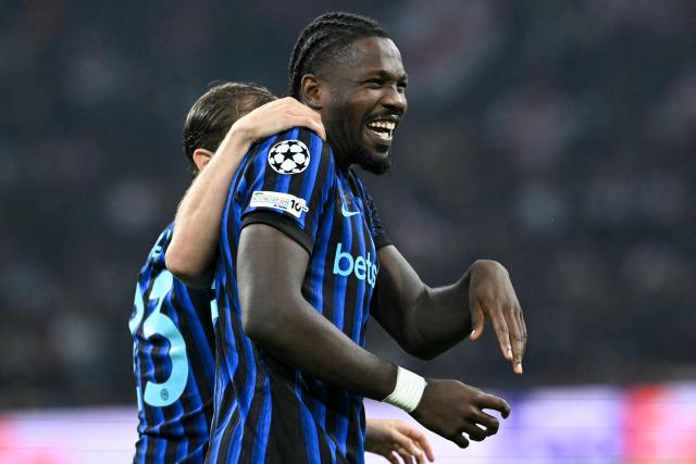 Inter Milan's French forward #09 Marcus Thuram celebrates scoring his team's second goal during the UEFA Champions League first round day 1 football match between Ajax Amsterdam and Inter Milan, at the Johan Cruijff ArenA in Amsterdam, on September 17, 2025. (Photo by NICOLAS TUCAT / AFP)