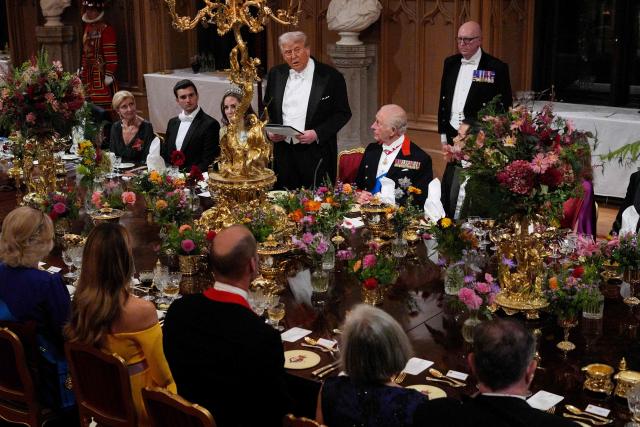 US President Donald Trump delivers a speech as Britain's King Charles III watches on during a State Banquet at Windsor Castle, in Windsor, on September 17, 2025, during the US President's second State Visit. US President Donald Trump arrived in Britain for an unprecedented second State Visit, with the UK government rolling out a royal red carpet welcome to win over the mercurial leader. (Photo by Yui Mok / POOL / AFP)