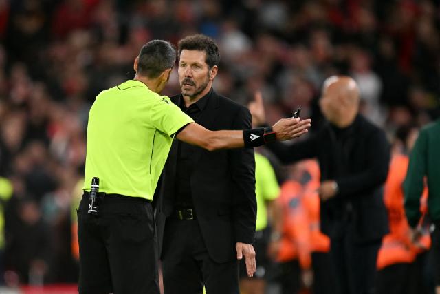 Atletico Madrid's Argentine coach Diego Simeone is sent off by the Italian referee Maurizio Mariani during the UEFA Champions League first round football match between Liverpool and Atletico Madrid at Anfield in Liverpool, north west England on September 17, 2025. (Photo by Oli SCARFF / AFP)