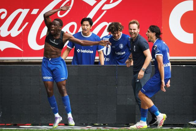 KAA Gent's Ivorian forward #45 Hyllarion Goore (L) celebrates after scoring a goal  during the Belgian Pro League Belgian Pro League football match between KAA Gent and Club Brugge at the KAA Stadium in Ghent on August 31, 2025. (Photo by KURT DESPLENTER / BELGA / AFP) / Belgium OUT