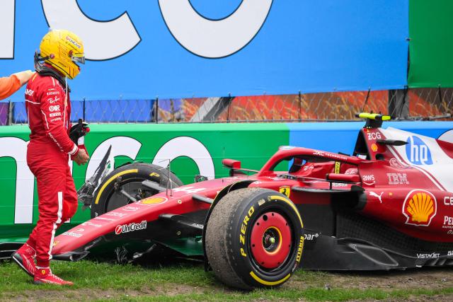 Ferrari's British driver Lewis Hamilton looks at his car after crashing during the Formula One Dutch Grand Prix at The Circuit Zandvoort, western Netherlands, on August 31, 2025. (Photo by JOHN THYS / AFP)