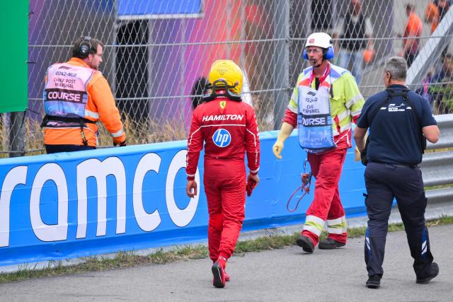 Ferrari's British driver Lewis Hamilton exits the track after crashing during the Formula One Dutch Grand Prix at The Circuit Zandvoort, western Netherlands, on August 31, 2025. (Photo by JOHN THYS / AFP)
