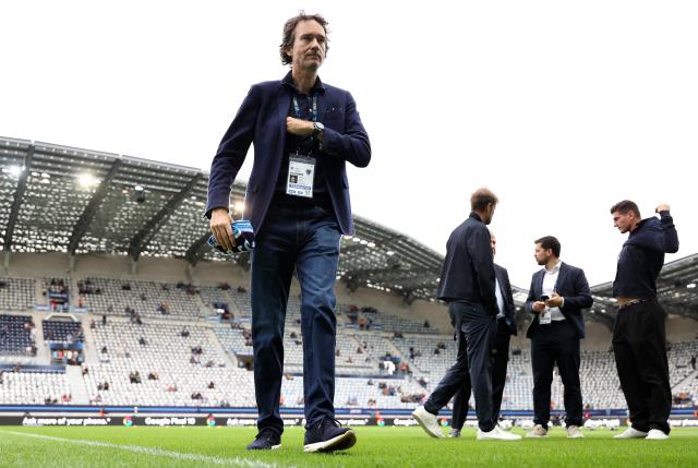 French representative of the Agache family holding company, Antoine Arnault walks on the pitch ahead of the French L1 football match between Paris FC and FC Metz at the Stade Jean-Bouin in Paris on August 31, 2025. (Photo by FRANCK FIFE / AFP)