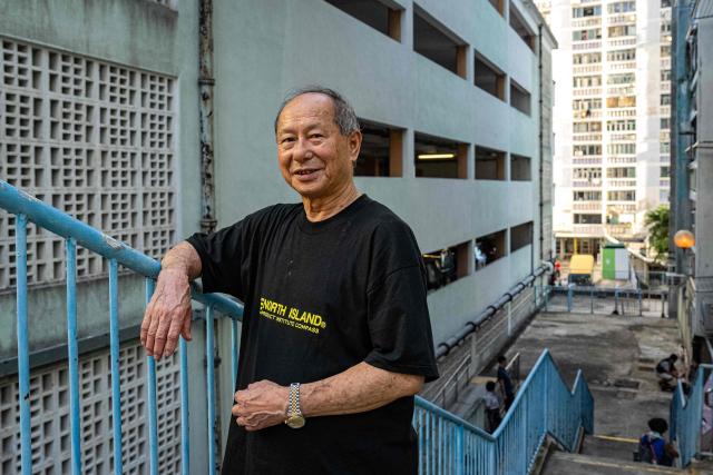 Yiu Siu-fung, a former organiser of the Hungry Ghost or the Yu Lan festival at the Wah Fu Estate poses for a photograph during an interview with AFP on the occasion of the festival in Hong Kong on August 31, 2025. Eyes glowing red, the towering "ghost king" presided over the atrium of a Hong Kong housing block on August 31, as residents performed age-old rituals -- a scene that may become history as redevelopment looms. (Photo by Leung Man Hei / AFP)