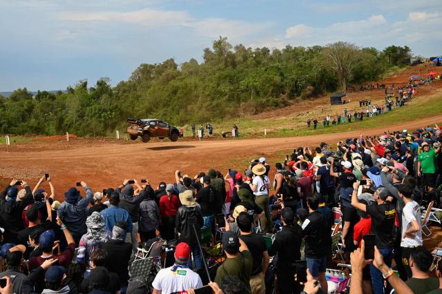 French driver Sebastien Ogier and co-driver Vincent Landais compete in their Toyota GR Yaris Rally1 during the Trinidad stage of the WRC Rally Paraguay, 10th stage of the FIA World Rally Championship (WRC), in Trinidad, near Encarnacion, Paraguay, on August 31, 2025. (Photo by Luis ROBAYO / AFP)