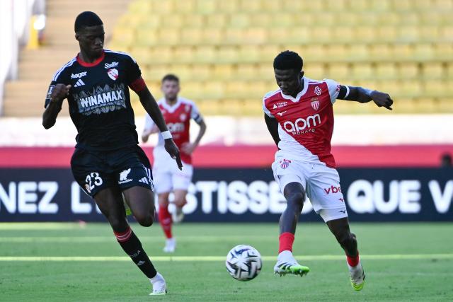 Strasbourg's French defender #23 Mamadou Sarr (L) fights for the ball with Monaco's Senegalese midfielder #15 Lamine Camara (R) during the French L1 football match between AS Monaco and RC Strasbourg Alsace at the Louis II Stadium in the Principality of Monaco on August 31, 2025. (Photo by FREDERIC DIDES / AFP)