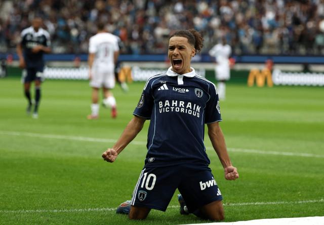 Paris FC's  French midfielder #10 Ilan Kebbal celebrates scoring a goal  during the French L1 football match between Paris FC and FC Metz at the Stade Jean-Bouin in Paris on August 31, 2025. (Photo by FRANCK FIFE / AFP)