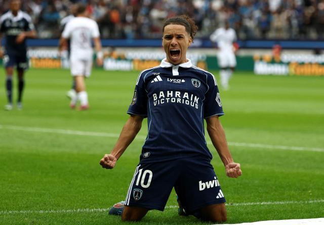 Paris FC's  French midfielder #10 Ilan Kebbal celebrates scoring a goal  during the French L1 football match between Paris FC and FC Metz at the Stade Jean-Bouin in Paris on August 31, 2025. (Photo by FRANCK FIFE / AFP)
