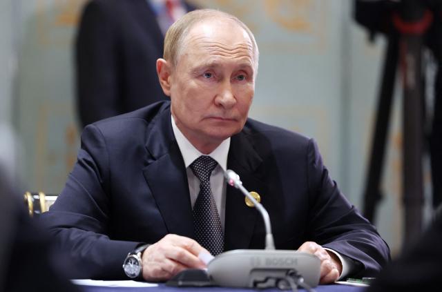 In this pool photograph distributed by the Russian state agency Sputnik, Russia's President Vladimir Putin attends a meeting with Iran's president on the sidelines of the Shanghai Cooperation Organisation (SCO) Summit in Tianjin on September 1, 2025. (Photo by Alexander KAZAKOV / POOL / AFP)