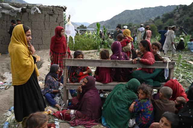 Afghan injured women and girls sit as they receive medical treatment at a field ollowing earthquakes in the Mazar Dara village of Nurgal, a district of the Kunar Province, in Eastern Afghanistan, on September 1, 2025. More than 800 people have died and over 2,700 were injured from August 31 night to September 1, 2025, in eastern Afghanistan after a 6-magnitude earthquake, followed by at least five aftershocks felt hundreds of kilometers away. (Photo by Wakil Kohsar / AFP)