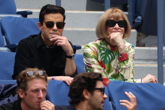 Vogue's global editorial director Anna Wintour (top, R) and US actor Rami Malek (top, L) attend the men's singles round of 16 tennis match between Canada’s Felix Auger-Aliassime and Russia’s Andrey Rublev on day nine of the US Open tennis tournament at the USTA Billie Jean King National Tennis Center in New York City, on September 1, 2025. (Photo by TIMOTHY A.CLARY / AFP)
