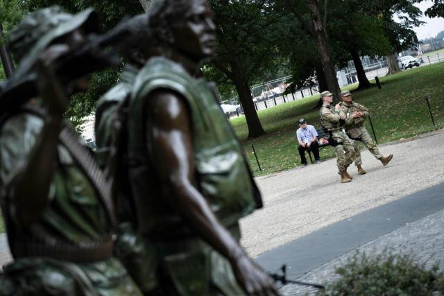 Members of the National Guard patrol the National Mall on September 17, 2025, in Washington, DC. US President Donald Trump on September 15 signed an order sending National Guard troops to the city of Memphis, in the latest stage of his crime crackdown that critics have branded authoritarian. Trump said the task force would be a "replica" of the one he sent into the capital Washington in August. (Photo by Brendan Smialowski / AFP)