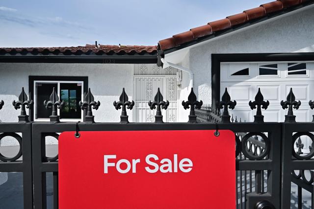 A 'for sale' sign is seen on a house in Monterey Park, California, on September 17, 2025. The US Federal Reserve on September 17 lowered interest rates for the first time this year, flagging slower job gains and risks to employment as policymakers face heightened pressure under President Donald Trump. (Photo by Frederic J. BROWN / AFP)