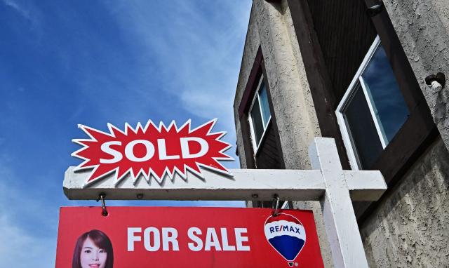 A 'sold' sign is seen on a house in Monterey Park, California, on September 17, 2025. The US Federal Reserve on September 17 lowered interest rates for the first time this year, flagging slower job gains and risks to employment as policymakers face heightened pressure under President Donald Trump. (Photo by Frederic J. BROWN / AFP)