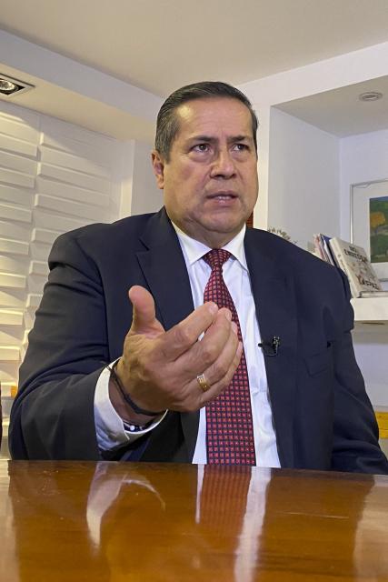 Special Jurisdiction of Peace (JEP) magistrate Camilo Suarez speaks during an AFP interview after the sentence of former FARC guerrilla leaders over kidnapping crimes committed during the Colombian armed conflict, at the JEP headquarters in Bogota on September 17, 2025. (Photo by Juan Restrepo / AFP)