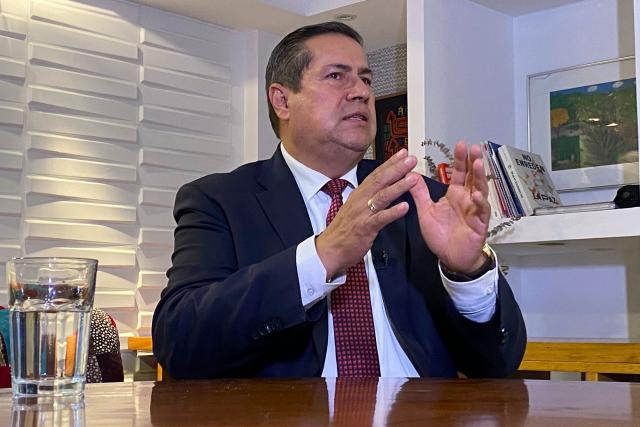 Special Jurisdiction of Peace (JEP) magistrate Camilo Suarez speaks during an AFP interview after the sentence of former FARC guerrilla leaders over kidnapping crimes committed during the Colombian armed conflict, at the JEP headquarters in Bogota on September 17, 2025. (Photo by Juan Restrepo / AFP)