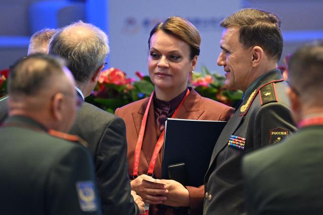 Russian Deputy Defence Minister Anna Tsivileva (C) speaks with delegates after the plenary session of the Xiangshan Forum at the Beijing International Convention Center in Beijing on September 18, 2025. (Photo by GREG BAKER / AFP)