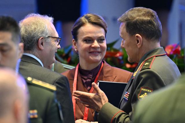Russian Deputy Defence Minister Anna Tsivileva (C) speaks with delegates after the plenary session of the Xiangshan Forum at the Beijing International Convention Center in Beijing on September 18, 2025. (Photo by GREG BAKER / AFP)