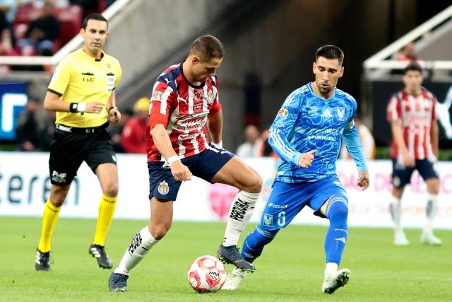 Guadalajara's forward #14 Javier Hernandez and Tigres' Uruguayan midfielder #08 Fernando Gorriaran fight for the ball during the Liga MX Apertura football tournament match between Guadalajara and Tigres at the Akron Stadium in Zapopan, Jalisco state, Mexico on September 17, 2025. (Photo by Ulises Ruiz / AFP)