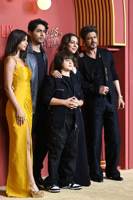 Bollywood actor Shah Rukh Khan (R) poses along with his wife Gauri Khan (2R) and children Aryan Khan (2L), AbRam Khan (C) and Suhana Khan during the premiere of Netflix's series 'The Ba***ds of Bollywood', in Mumbai on September 17, 2025. (Photo by Sujit JAISWAL / AFP)