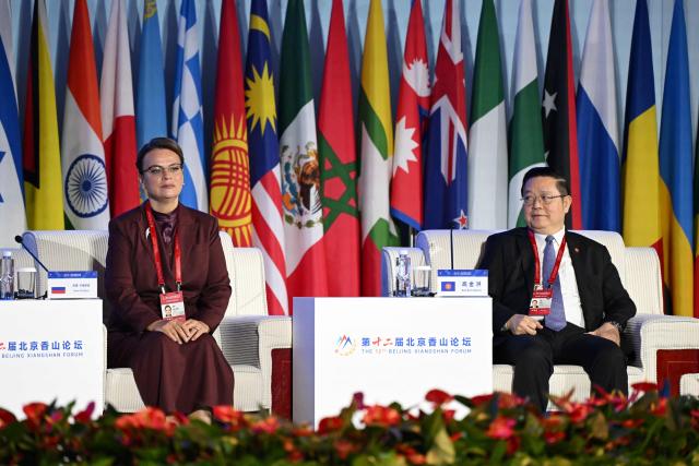 Russian Deputy Defence Minister Anna Tsivileva (L) sits next to ASEAN Secretary-General Kao Kim Hourn during the plenary session of the Xiangshan Forum at the Beijing International Convention Center in Beijing on September 18, 2025. (Photo by GREG BAKER / AFP)