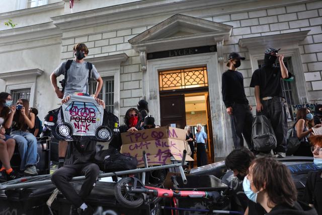 Students block the entrance to their school (lycée Thiers) in central Marseille, southeastern France, on September 18, 2025, during a day of nationwide strikes and protests called by unions over France's national budget. France is bracing for a day of nationwide protests on September 18, 2025, with a source close to the authorities saying some 800,000 people are expected to take to the streets. In a rare show of unity, trade unions have urged French people to strike in protest at the authorities' "horror show" draft budget designed to reduce France's ballooning debt. (Photo by Clement MAHOUDEAU / AFP)