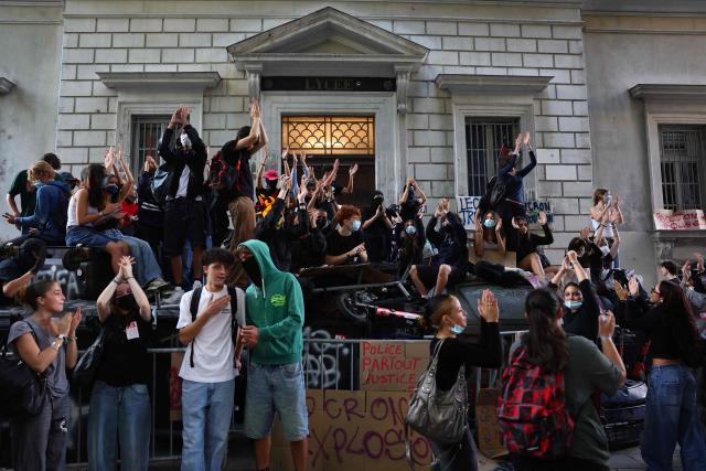 Students block the entrance to their school (lycée Thiers) in central Marseille, southeastern France, on September 18, 2025, during a day of nationwide strikes and protests called by unions over France's national budget. France is bracing for a day of nationwide protests on September 18, 2025, with a source close to the authorities saying some 800,000 people are expected to take to the streets. In a rare show of unity, trade unions have urged French people to strike in protest at the authorities' "horror show" draft budget designed to reduce France's ballooning debt. (Photo by Clement MAHOUDEAU / AFP)