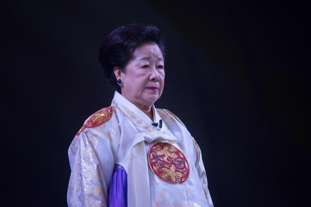 (FILES) Unification Church leader Hak Ja-Han attends a mass wedding ceremony entitled a 'cosmic blessing ceremony', in Gapyeong on September 7, 2017. South Korean prosecutors on September 18, 2025 requested an arrest warrant for the leader of the Unification Church, Han Hak-ja, over bribery linked to a former first lady and incitement to destroy evidence. (Photo by Ed JONES / AFP)