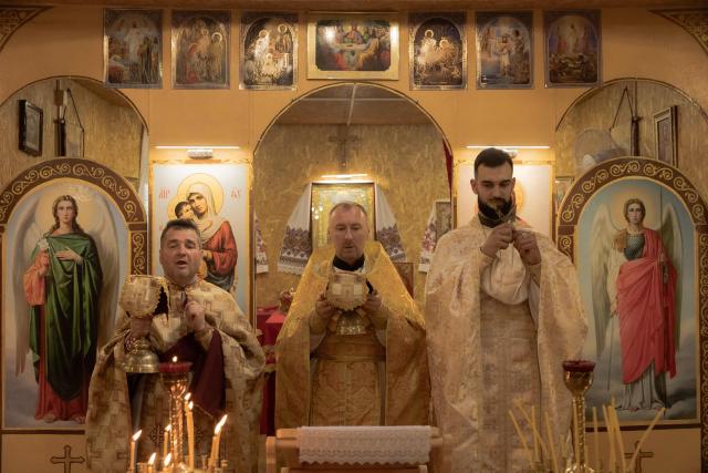 (FILES) Ukrainian priests lead a prayer service at the Church of the Holy Martyrs Vira, Nadiya, Lyubov, and Mother Sophia of the Orthodox Church of Ukraine, which is aligned with Kyiv, in Kramatorsk, on July 13, 2025, amid the Russian invasion of Ukraine. Near bloody battles between Ukrainian and Russian forces in east Ukraine, a very different kind of conflict is taking place: a battle for believers' souls. Two rival Orthodox churches -- one set up with Ukrainian government backing in 2018 and the other an older church tied to Moscow -- compete for followers in Kramatorsk, some 20 kilometres (12 miles) from the front line. (Photo by Roman PILIPEY / AFP)
